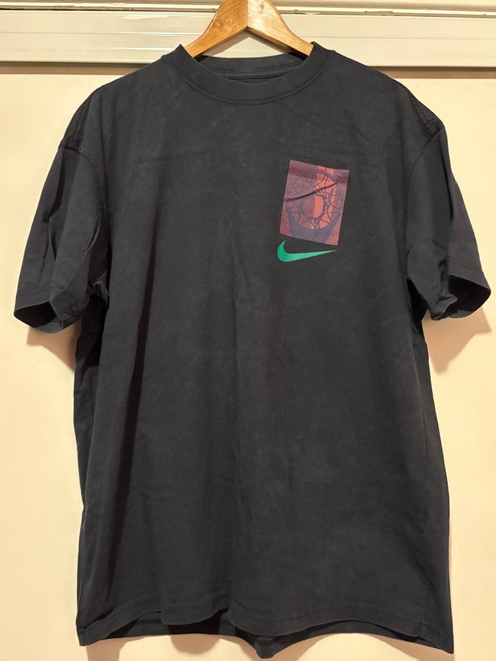 Nike Black Short-Sleeve T-Shirt with Teal Swoosh and Purple Chest Graphic